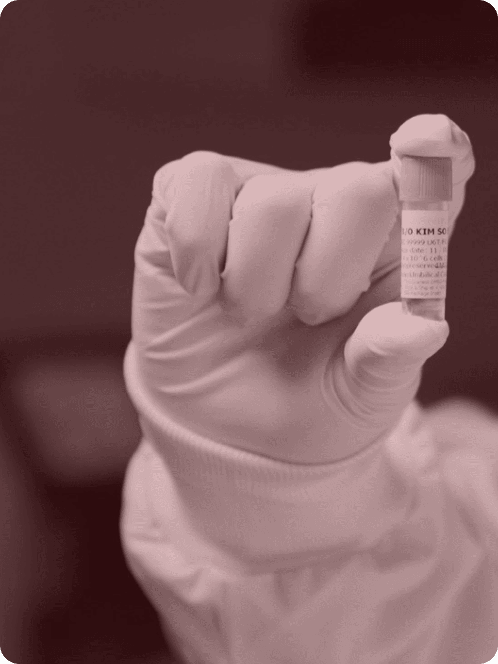 Scientist holding vial